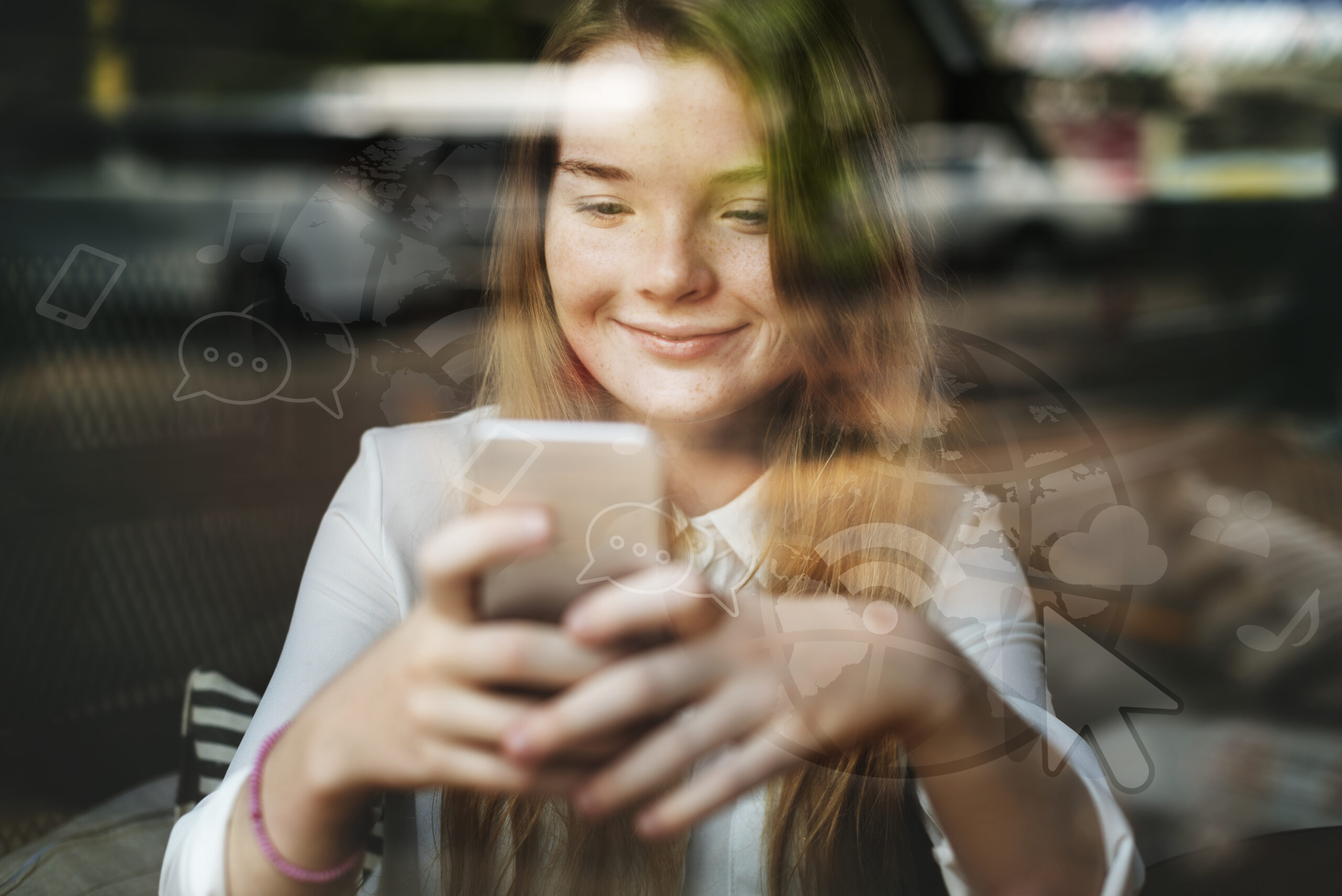 young blond girl texting cafe scaled