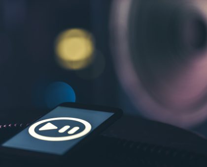 Music background with phone and with music icon and column, modern technology concept, listening to music.